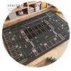 A dark play mat with painted car traffic lines is shown in a wooden nursery setting.