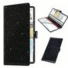 A black leather document organizer featuring a clear sleeve and an open display of registration and insurance cards.