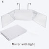 A trifold mirror with integrated light, shown in an open, angled display.