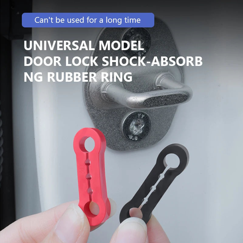 A hand holds a red door lock shock-absorbing rubber ring and a black door lock ring against a gray door surface.