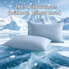 Two white ice silk pillowcases displayed on a blue icy surface with a snowy mountain background.