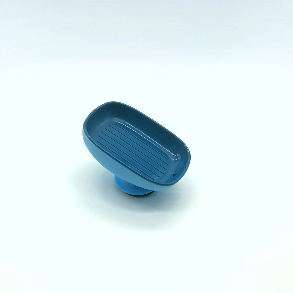 A blue leaf-shaped suction cup soap dish for bathroom and shower.