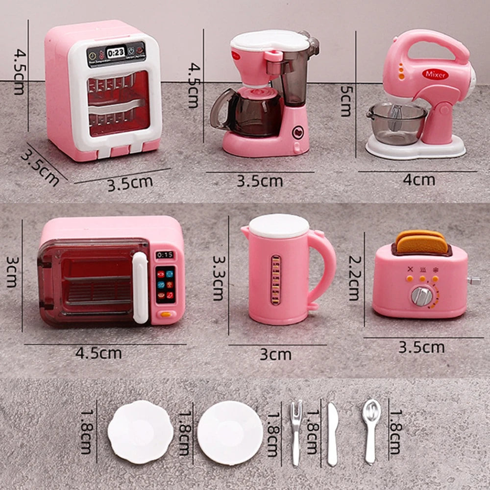 A set of pink and white fashion doll accessories including a hand mixer, a mini toaster, a mug, and cutlery.