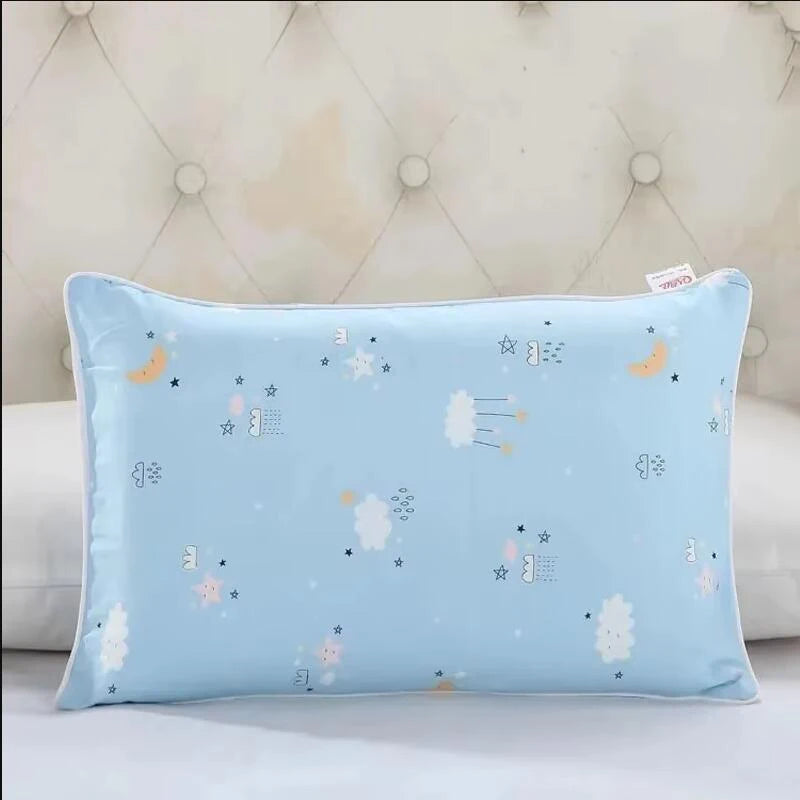 Light blue cartoon pillow featuring stars, clouds, and moons for kids