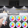 RGB LED under cabinet light fixtures and remote control buttons shown in a kitchen context
