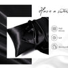 Black silky satin pillowcase draped next to text promoting a sweet dream and product features.