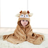 A baby wearing a brown fuzzy hooded towel with a cartoon animal design lying on a white surface.