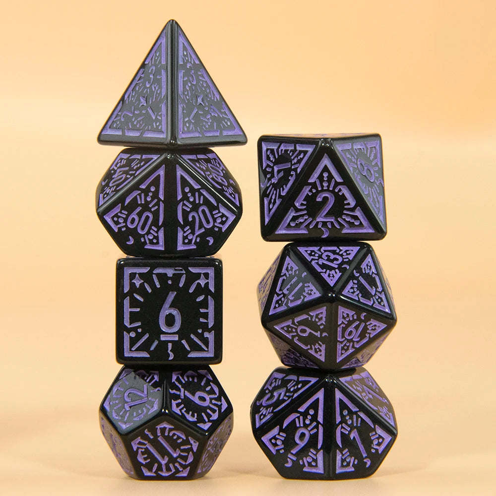 A set of five black polyhedral dice with purple accents arranged vertically on a light background.