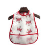 White baby feeding bib with pink fox designs and a catch pocket hanging on a wooden hanger