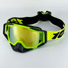 A pair of black and neon yellow motorcycle goggles with a black strap, shown against a white background.