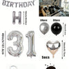 A kit featuring black and silver balloons, including foil numbers, heart shapes, and filler material for a balloon garland.