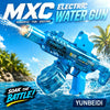 A blue electric water gun is firing a stream of water into the air against a tropical background.