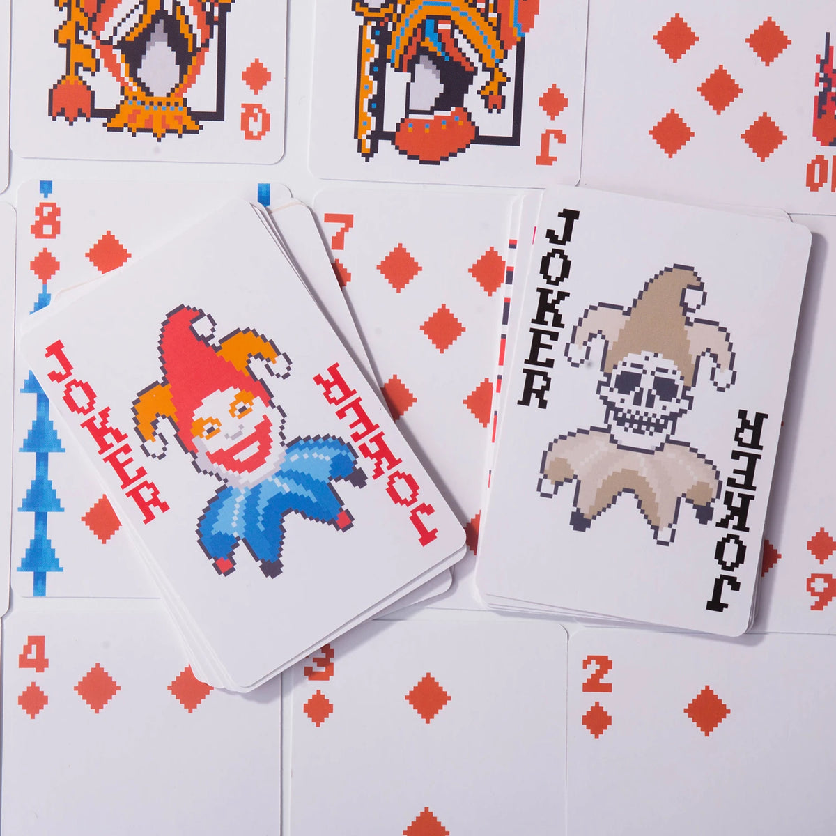 A collection of classic poker cards featuring various face cards and the joker card.