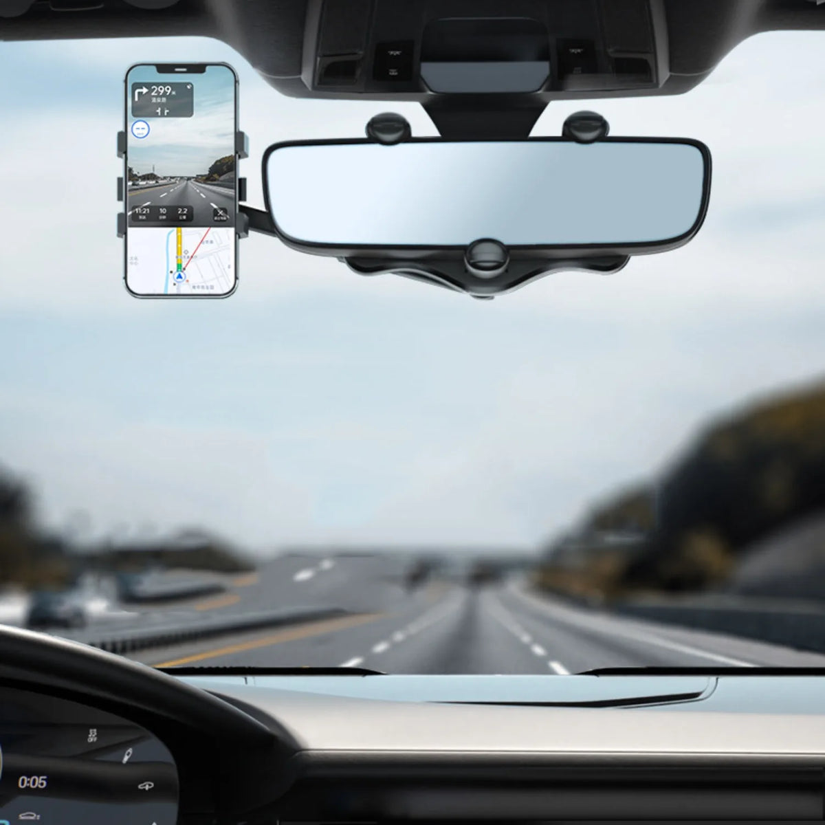 A view from inside a car showing a phone mounted on a rearview mirror for navigation.