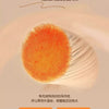 Close-up of a fluffy orange textile product showing its texture and warmth.