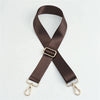 A dark brown nylon bag strap with a gold buckle shown in an 'X' shape.