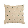 A beige plush throw pillow cover patterned with small green pumpkin shapes.