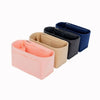 Three felt purse organizer inserts in pink, beige, and navy blue.