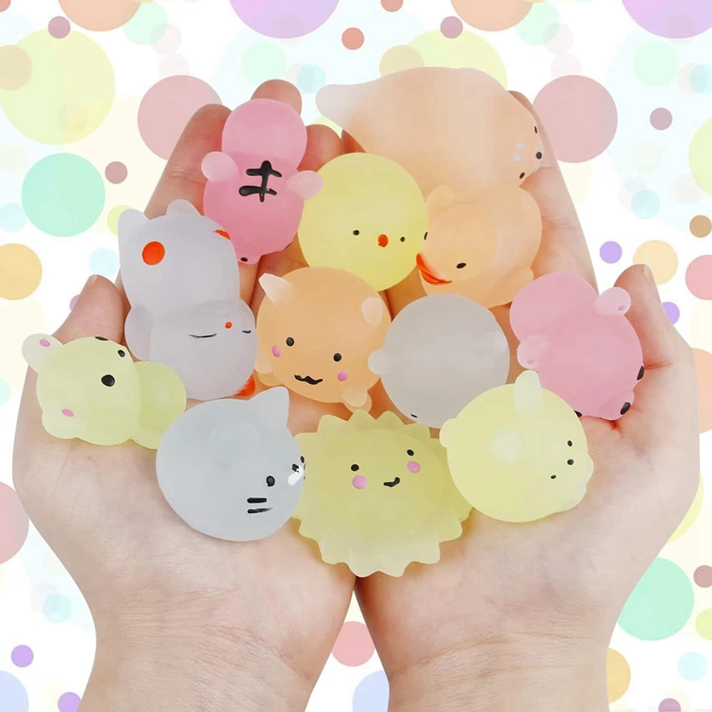 A hand holds a collection of pink and yellow kawaii animal squishies toys against a colorful, bokeh background.