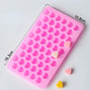 A pink silicone mold with heart-shaped cavities for DIY candles, soap, and chocolate, showing various heart shapes.