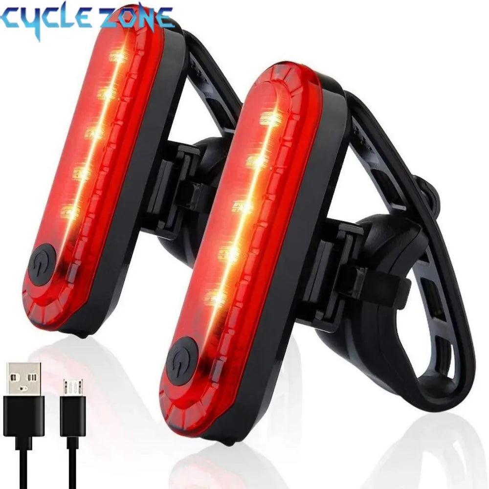 A pair of red bicycle tail lights with integrated USB charging ports and four operating modes.