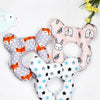 A set of soft, fabric baby head and neck support pillows featuring various animal faces in pink, gray, and white.