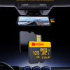 A camera mounted on a car dashboard shows a view of the road, with a Kodak microSD card nearby.