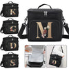 Black insulated canvas lunch bag featuring a gold initial monogram and floral accents.