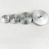 Four polished stainless steel ceiling mount canopy discs for pendant lights