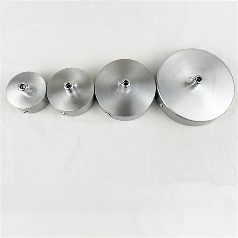 Four polished stainless steel ceiling mount canopy discs for pendant lights