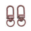 A pair of rose gold colored alloy lobster clasp hooks for DIY jewelry making