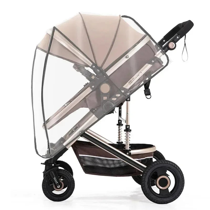 A transparent waterproof stroller rain cover with a beige canopy and a black frame on wheels.