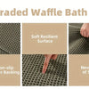 Close-up view of an upgraded waffle bath mat showing its soft resilient surface, non-slip rubber backing, and flexible textur