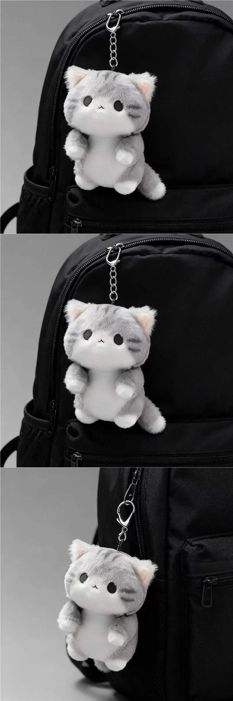 A soft grey cat plush charm hanging from a keychain attached to a black backpack.