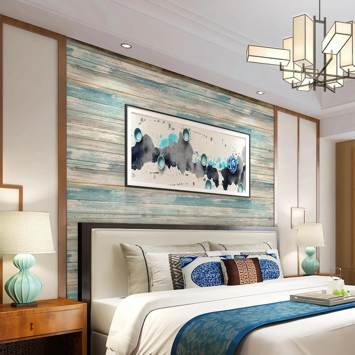 Bedroom featuring a bed with blue bedding against a wall covered in vintage wood grain peel and stick wallpaper.