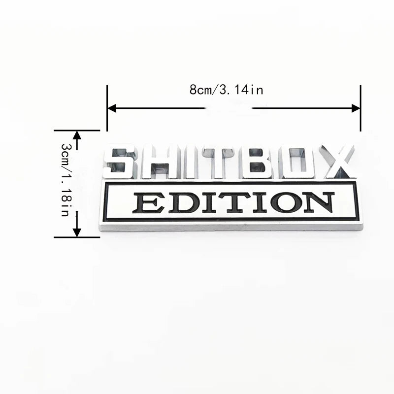 Rechteckiges schwarzes und silbernes Aufkleb-Abzeichen-Set mit dem Text SHITBOX EDITION