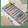 A set of eight transparent mesh zipper pouches in various sizes stored in a white cabinet drawer.