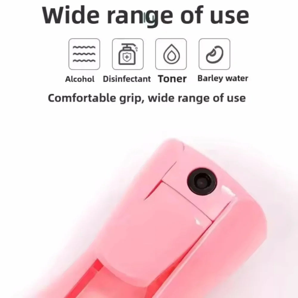 Pink ultra-fine mist spray bottle with a comfortable grip shown in a close-up view.
