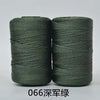 Two spools of dark green 3-ply polyester knitting yarn for crochet and hand crafts