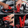 Hands clamp heavy-duty red jump starter cables onto a car battery terminal for vehicle jump starting.