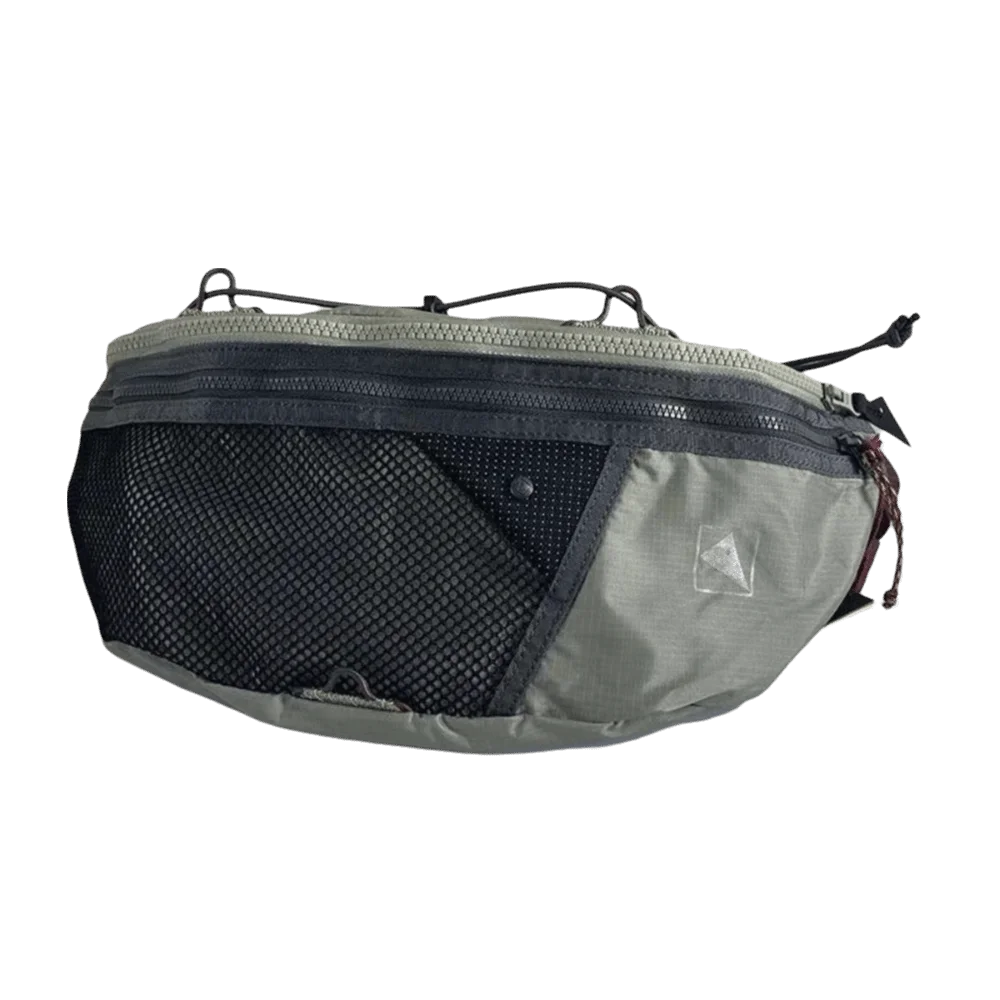 A gray and black nylon crossbody bag with a mesh front and adjustable strap.