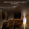A white night light projector illuminates a cozy bedroom with a starry ceiling and leopard print bedding.