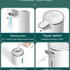 A white touchless automatic soap dispenser showing its sensing area, water inlet, and USB charging features.