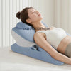 A woman is resting her eyes on a memory foam full-body support pillow while lying down.