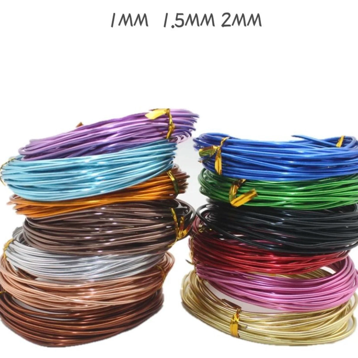 A collection of anodized aluminum jewelry wire in various colors including purple, blue, green, black, and copper.