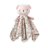 A pink stuffed animal with a floral fabric cape and a light pink body.