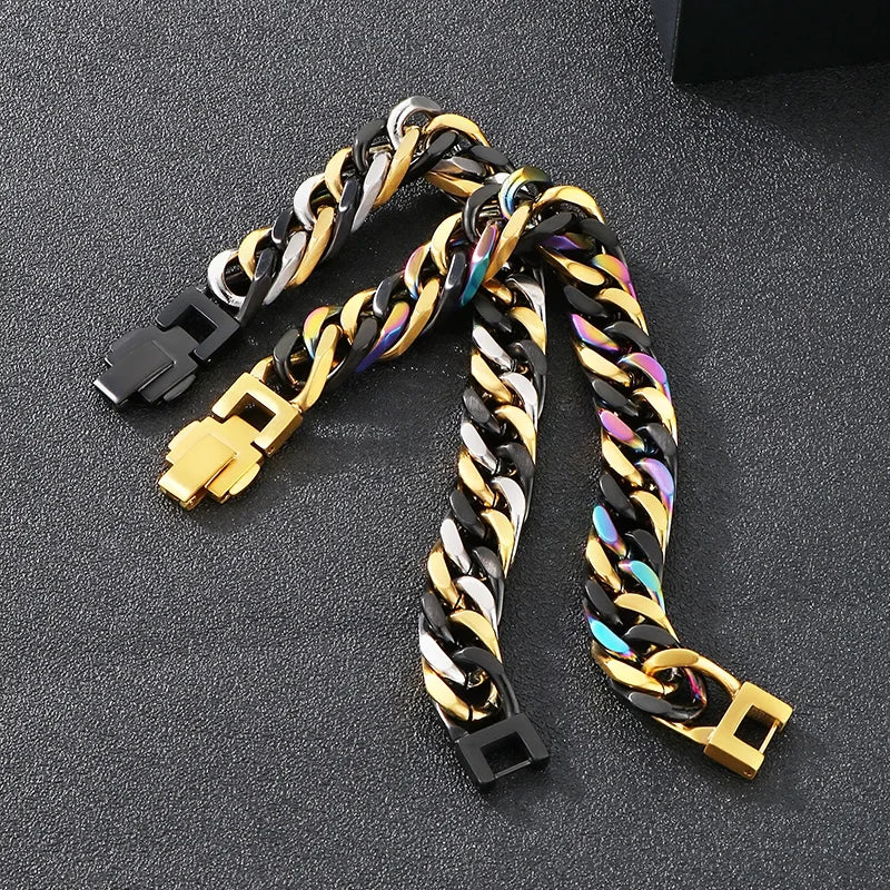 A close-up of a chunky stainless steel Cuban chain bracelet featuring black and gold links.