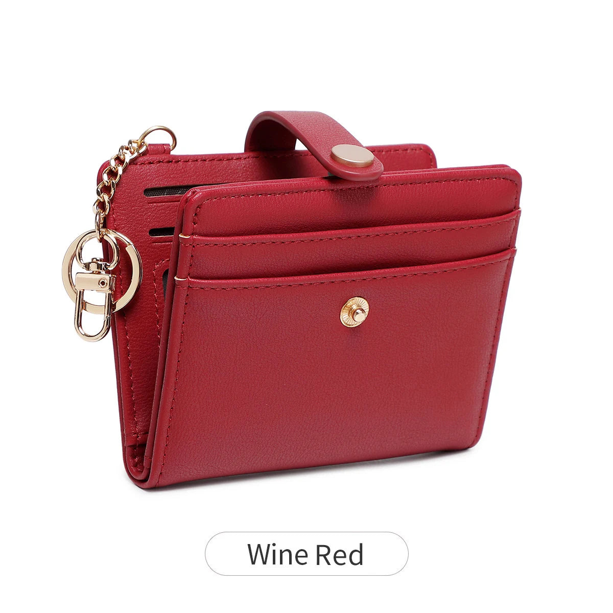 A maroon bi-fold credit card wallet with a gold chain and brass hardware.