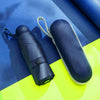 A dark blue compact 5-fold travel umbrella with a light gray strap is shown against a blue and yellow background.