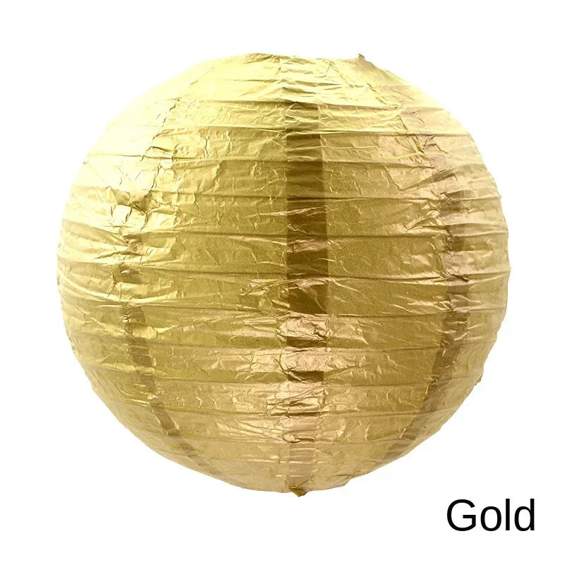 A round, crinkled gold paper lantern.